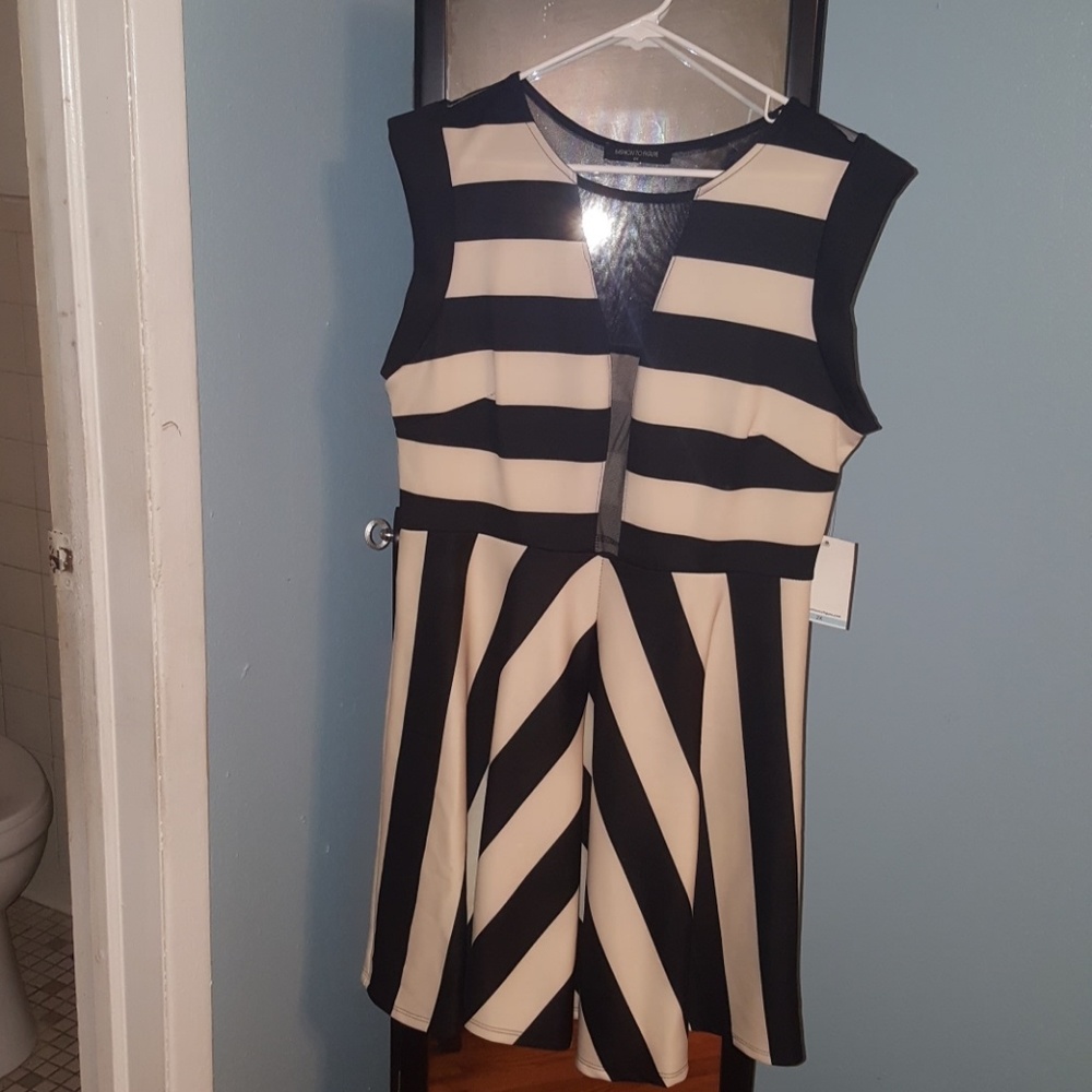cream and black mesh low cut dress.